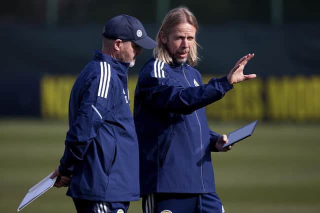 Austin MacPhee, right, discusses tactics with Steve Clarke. The Aston Villa coach has made an impact with his set-piece expertise.