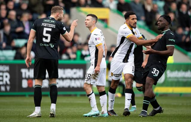 Livingston's Jason Holt (centre) exchanges words with Hibs Ryan Porteous after being sent off at Easter Road.