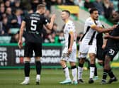 Livingston's Jason Holt (centre) exchanges words with Hibs Ryan Porteous after being sent off at Easter Road.