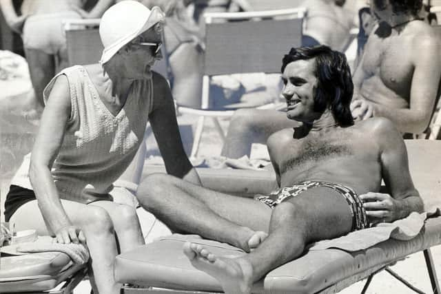 George Best pictured on a beach near Palma, Majorca with his landlady Mary Fullaway. Pic: Bob Aylott/Daily Mail/Shutterstock (1080079a)