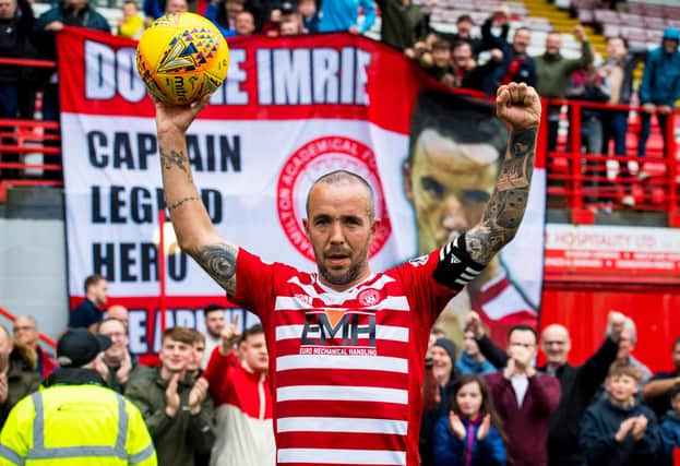 Dougie Imrie at the end of his final game before retirement in May last year. Picture: SNS