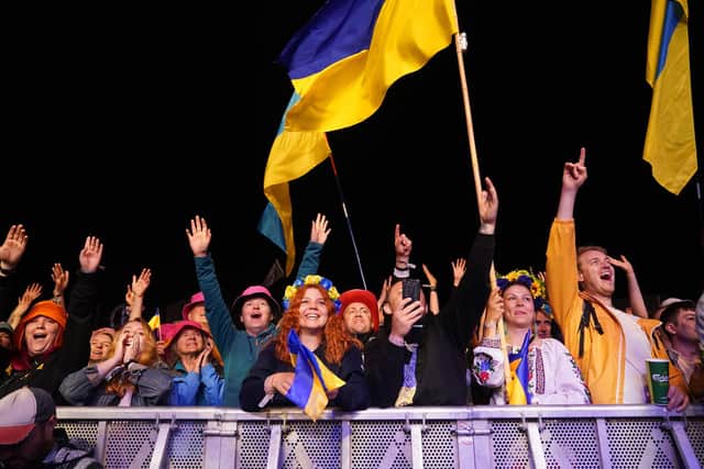 The crowd watching Kalush Orchestra, Eurovision winners from Ukraine, performing, during the Glastonbury Festival, as a UK-based think tank and charity has called for Ukrainian refugees and their UK host families to be given "priority tickets" to Eurovision 2023.