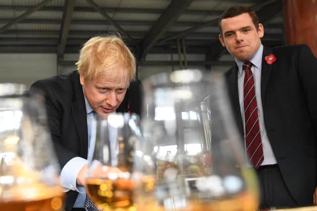 Boris Johnson and Scottish Conservative leader Douglas Ross, seen at the Roseisle Distillery, need to focus on conveying a sense of purpose and of a UK which will deliver and deliver fast, says John McLellan (Picture: Stefan Rousseau/PA)