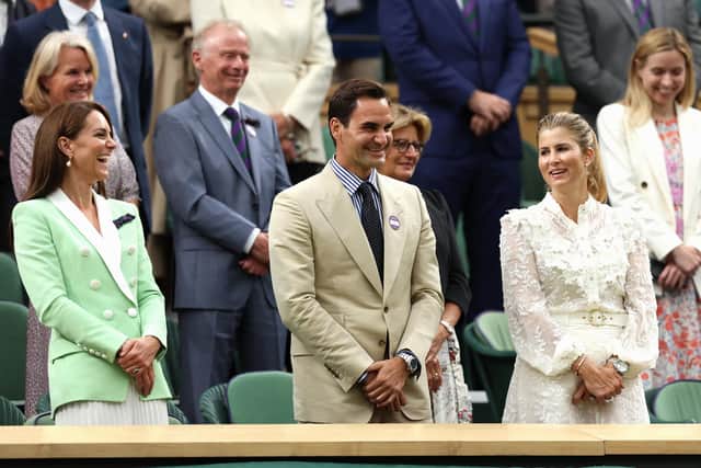Roger Federer, flanked by his wife Mirka and the Princess of Wales, laughs during Murray's winners' speech.
