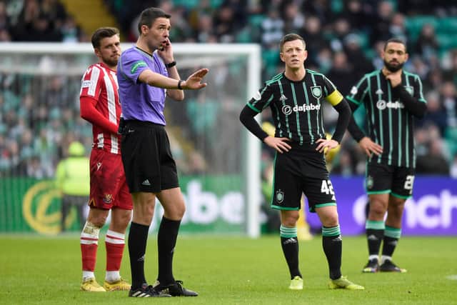 Referee Kevin Clancy pauses play while VAR check an offside in the build up to Reo Hatate's goal during a cinch Premiership match between Celtic and St Johnstone.