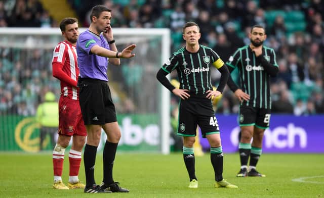 Referee Kevin Clancy pauses play while VAR check an offside in the build up to Reo Hatate's goal during a cinch Premiership match between Celtic and St Johnstone.