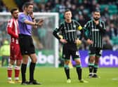 Referee Kevin Clancy pauses play while VAR check an offside in the build up to Reo Hatate's goal during a cinch Premiership match between Celtic and St Johnstone.