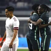 Calvin Bassey (right) celebrates with team-mate Terem Moffi after setting up Nigeria's goal in their 2-1 friendly defeat against Mexico in Texas on Saturday night. (Photo by Ron Jenkins/Getty Images)