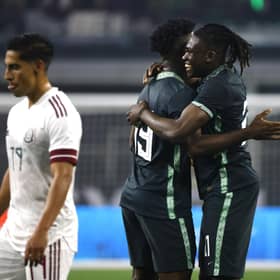 Calvin Bassey (right) celebrates with team-mate Terem Moffi after setting up Nigeria's goal in their 2-1 friendly defeat against Mexico in Texas on Saturday night. (Photo by Ron Jenkins/Getty Images)
