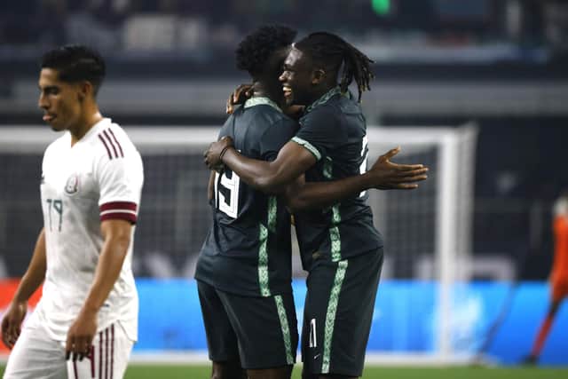 Calvin Bassey (right) celebrates with team-mate Terem Moffi after setting up Nigeria's goal in their 2-1 friendly defeat against Mexico in Texas on Saturday night. (Photo by Ron Jenkins/Getty Images)