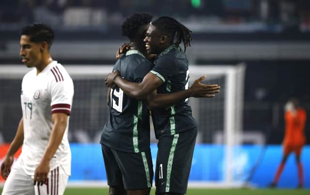 Calvin Bassey (right) celebrates with team-mate Terem Moffi after setting up Nigeria's goal in their 2-1 friendly defeat against Mexico in Texas on Saturday night. (Photo by Ron Jenkins/Getty Images)
