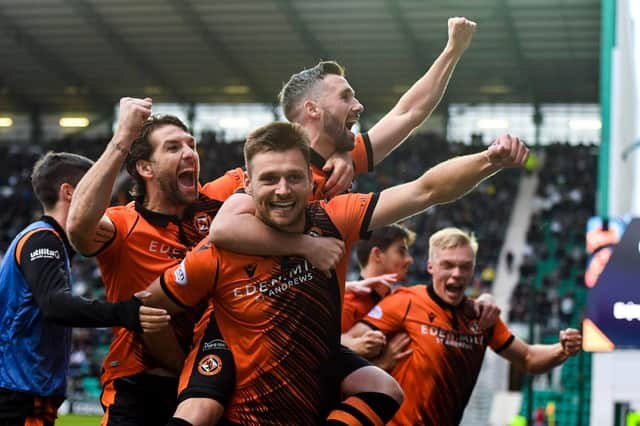 Dundee United's Ryan Edwards celebrates his goal with Nicky Clark in the 3-0 win over Hibs at Easter Road. (Photo by Ross MacDonald / SNS Group)