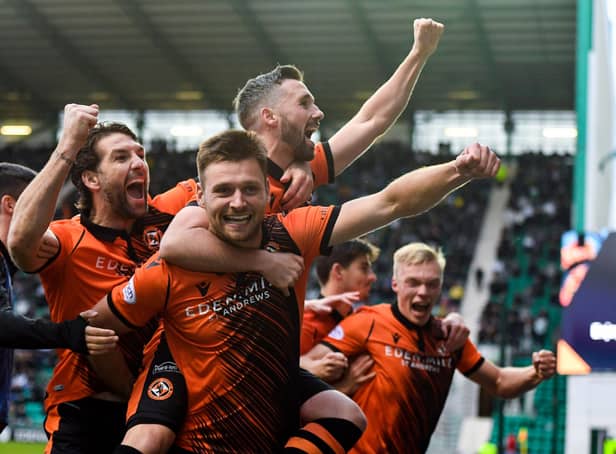 Dundee United's Ryan Edwards celebrates his goal with Nicky Clark in the 3-0 win over Hibs at Easter Road. (Photo by Ross MacDonald / SNS Group)