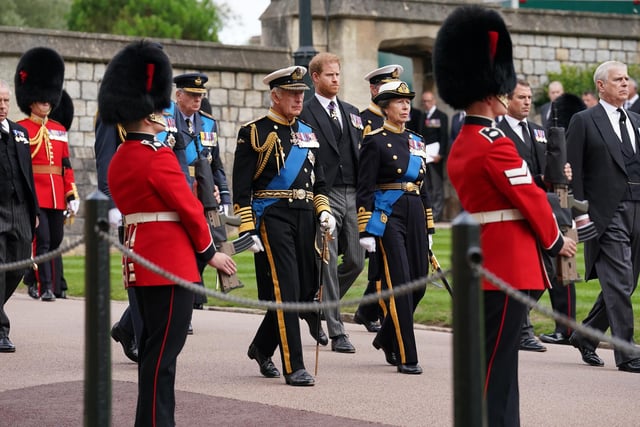 (left to right) The Prince of Wales,(hidden) the Duke of Sussex, Peter Phillips, King Charles III, the Princess Royal and the Duke of York follow the State Hearse carrying the coffin of Queen Elizabeth II, draped in the Royal Standard with the Imperial State Crown and the Sovereign's Orb and Sceptre, as it arrives at the Committal Service held at St George's Chapel in Windsor Castle, Berkshire. Picture date: Monday September 19, 2022.