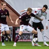 Hearts' Frankie Kent (L) and Aberdeen's Bojan Miovski in action during Saturday's match at Tynecastle.  (Photo by Mark Scates / SNS Group)