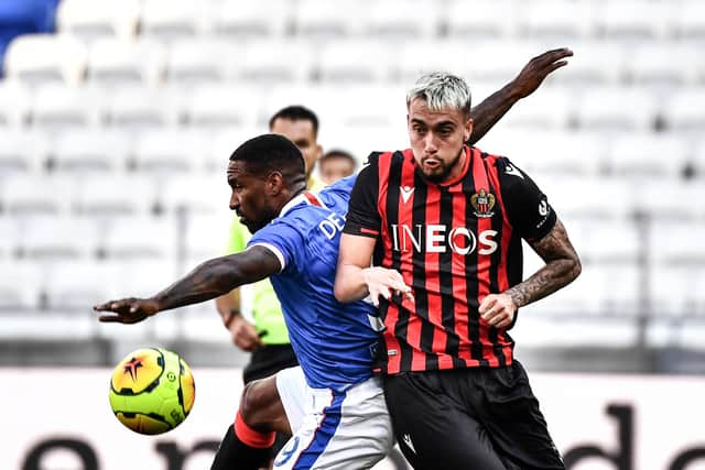 Jermain Defoe vies with Nice midfielder Remi Mestrallet.