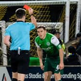 Paul Hanlon is sent off by referee Don Robertson as Hibs go down to nine men in the 1-0 defeat at Livingston (Photo by Ross Parker / SNS Group)