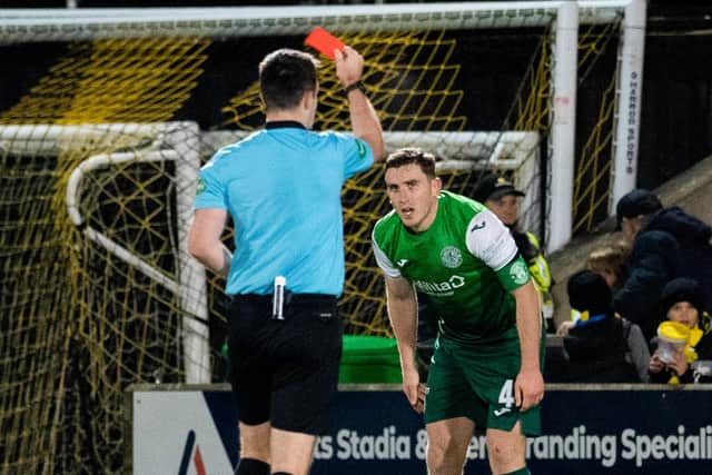 Paul Hanlon is sent off by referee Don Robertson as Hibs go down to nine men in the 1-0 defeat at Livingston (Photo by Ross Parker / SNS Group)