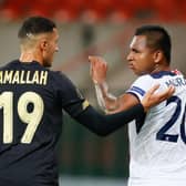 Selim Amallah of Standard and Alfredo Morelos of Rangers exchange views during the Group D clash in Liege