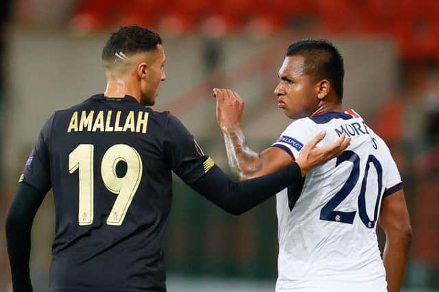 Selim Amallah of Standard and Alfredo Morelos of Rangers exchange views during the Group D clash in Liege