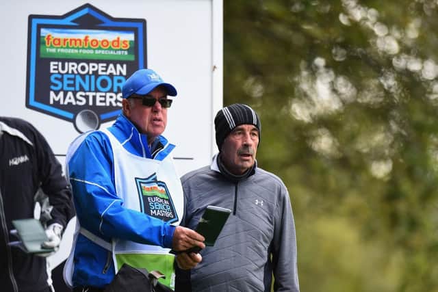 Sam Torrance talks tactics with his caddie Jim Noon in one of his final competitive appearances in the 2017 Farmfoods European Senior Masters at Marriott Forest Of Arden. Picture: Tony Marshall/Getty Images.
