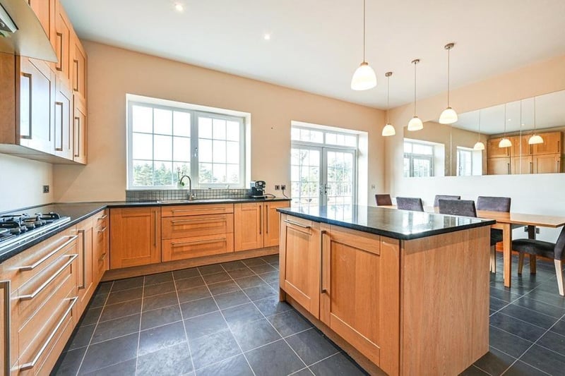 The kitchen is a great space for entertaining in and features double doors