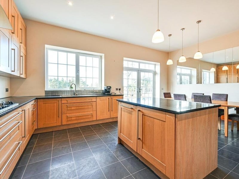 The kitchen is a great space for entertaining in and features double doors
