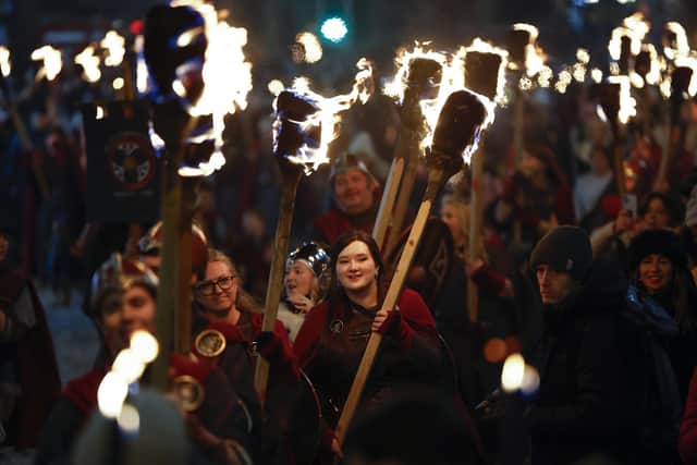 Shetland Vikings from the South Mainland Up Helly Aa fire festival led a torchlight procession through Edinburgh city centre to launch the 30th anniversary edition of the city's Hogmanay festival. Picture: Jeff J Mitchell/Getty Images