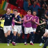 Scotland's Scott McTominay celebrates scoring his second goal against Spain with team-mate Kieran Tierney (Picture: Andrew Milligan/PA)