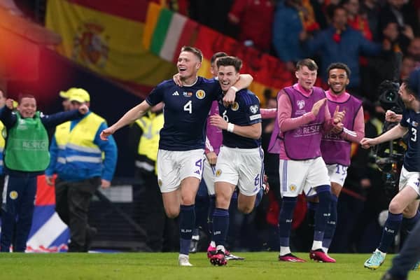 Scotland's Scott McTominay celebrates scoring his second goal against Spain with team-mate Kieran Tierney (Picture: Andrew Milligan/PA)