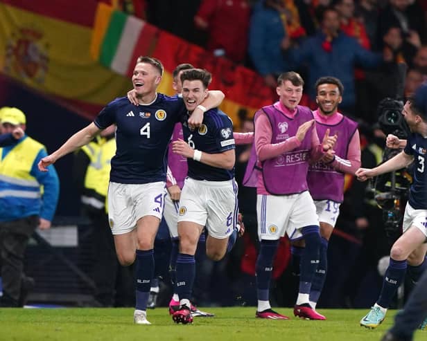 Scotland's Scott McTominay celebrates scoring his second goal against Spain with team-mate Kieran Tierney (Picture: Andrew Milligan/PA)