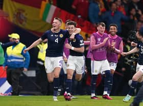 Scotland's Scott McTominay celebrates scoring his second goal against Spain with team-mate Kieran Tierney (Picture: Andrew Milligan/PA)