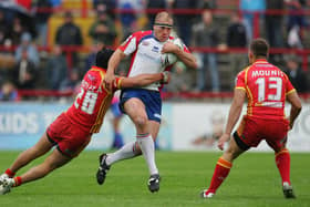 Ricky Bibey of Wakefield is tackled by Andrew Bentley of Catalan defence during the Engage Super League match betwen Wakefield Trinity Wildcats and Catalan Dragons at Belle Vue on May 27, 2007 in Wakefield, England.  (Photo by Laurence Griffiths/Getty Images)