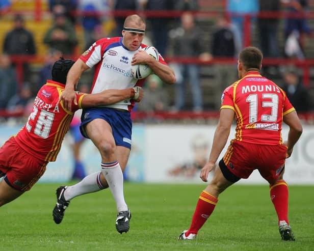 Ricky Bibey of Wakefield is tackled by Andrew Bentley of Catalan defence during the Engage Super League match betwen Wakefield Trinity Wildcats and Catalan Dragons at Belle Vue on May 27, 2007 in Wakefield, England.  (Photo by Laurence Griffiths/Getty Images)