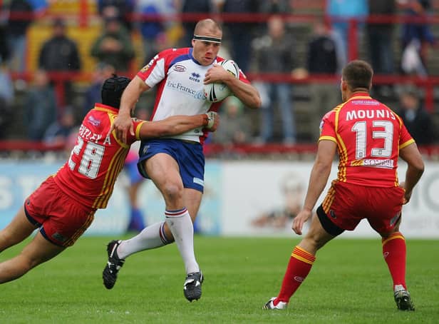 Ricky Bibey of Wakefield is tackled by Andrew Bentley of Catalan defence during the Engage Super League match betwen Wakefield Trinity Wildcats and Catalan Dragons at Belle Vue on May 27, 2007 in Wakefield, England.  (Photo by Laurence Griffiths/Getty Images)