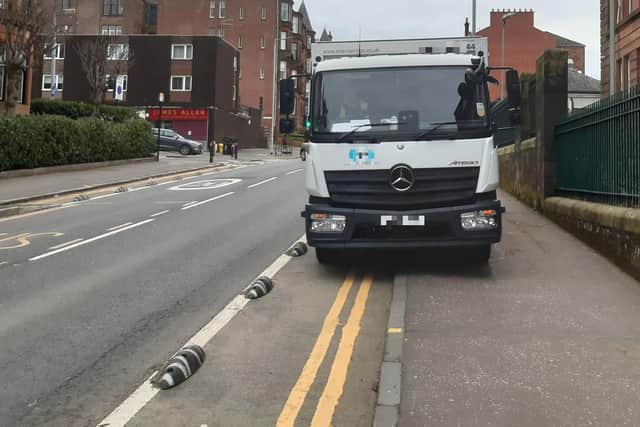 A delivery lorry blocking a new segregated cycle lane outside a Glasgow school this week. (Picture: The Scotsman)