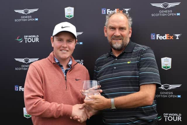 Bob MacIntyre was presented with the Jock MacVicar Trophy, awarded to the leading home player in the Genesis Scottish Open, by The Scotsman's golf correspondent Martin Dempster. Picture: Stephen Pond/Getty Images.