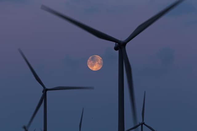 Community development groups are calling for the Scottish government to set up a new national wealth fund and set a target to ramp up community ownership of wind, solar and hydro power plants as an urgent priority to more fairly share the boom in renewable energy and generate millions of pounds for Scots across the country. Picture: Getty Images