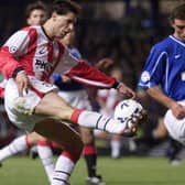 Ruud van Nistelrooy played against Rangers for PSV in the Champions League in 1999. Here he takes on Lorenzo Amoruso. PSV lost 4-1 at Ibrox