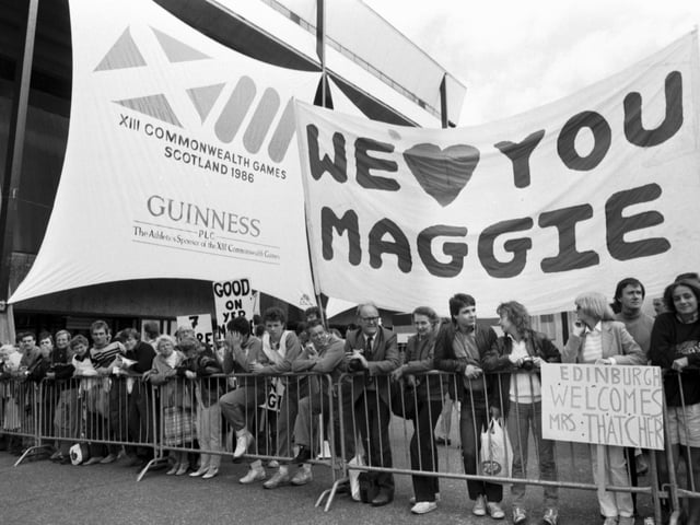 A pro-Thatcher crowd waits to welcome Prime Minister Margaret Thatcher to the Edinburgh Commonwealth Games.