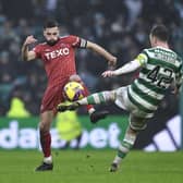 Aberdeen's Graeme Shinnie challenges Callum McGregor during the 4-0 defeat at Celtic Park. (Photo by Ross MacDonald / SNS Group)