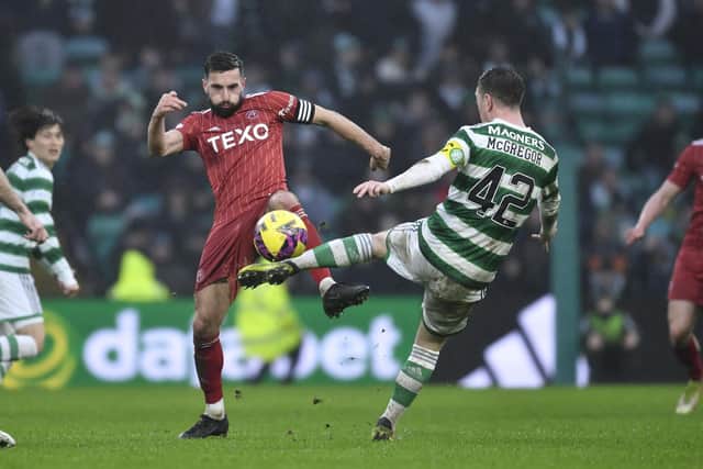 Aberdeen's Graeme Shinnie challenges Callum McGregor during the 4-0 defeat at Celtic Park. (Photo by Ross MacDonald / SNS Group)