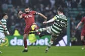Aberdeen's Graeme Shinnie challenges Callum McGregor during the 4-0 defeat at Celtic Park. (Photo by Ross MacDonald / SNS Group)