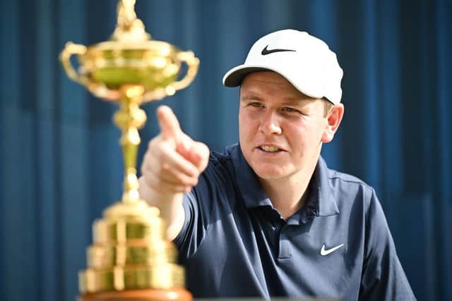 Bob MacIntyre points at the Ryder Cup, which was on display during the BMW International Open Pro-Am at Golfclub Munchen Eichenried in Germany. Picture: Stuart Franklin/Getty Images.