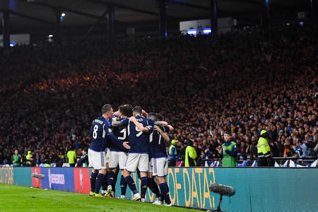 The Scotland players celebrate during the famous victory over Spain.