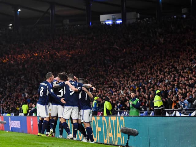 The Scotland players celebrate during the famous victory over Spain.