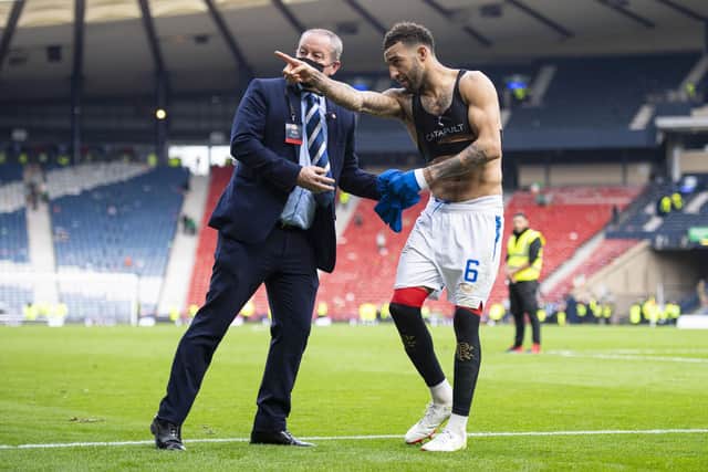 Connor Goldson hands his shirt to a fan after the semi-final win.  (Photo by Ross MacDonald / SNS Group)