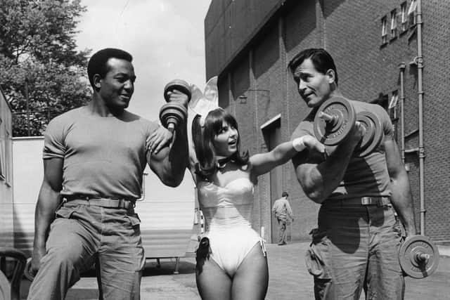 Jim Brown with co-star Clint Walker and Playboy bunny girl Dolly Read at Elstree Studios during the filming of The Dirty Dozen in 1966 (Picture: John Pratt/Keystone/Getty Images)