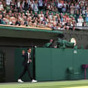 Roger Federer walks onto court during the Centre Court Centenary Celebration last year.