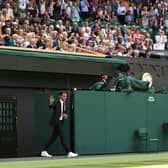 Roger Federer walks onto court during the Centre Court Centenary Celebration last year.